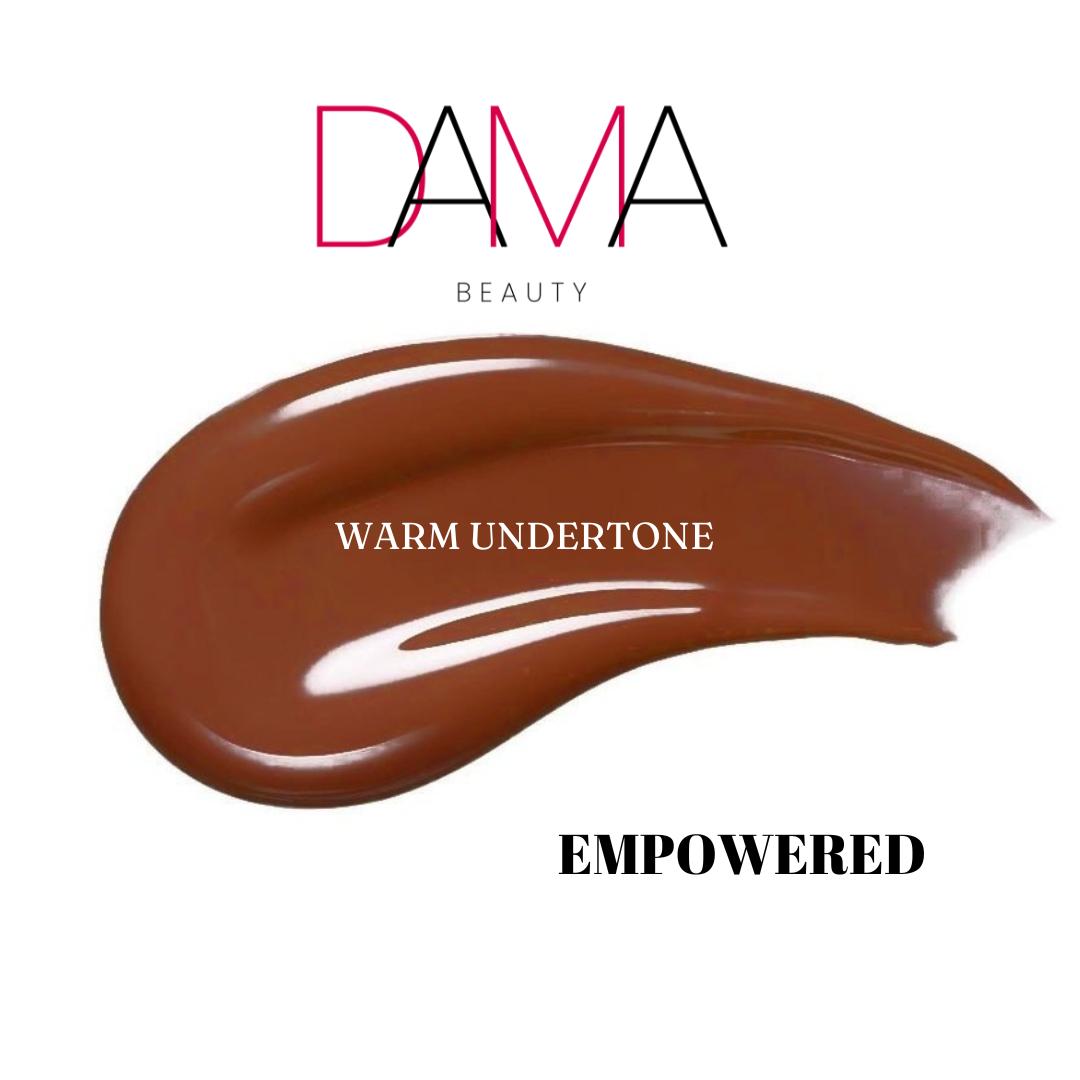Brown makeup swatch labeled 'Empowered' with 'DAMA Beauty' branding on a white background